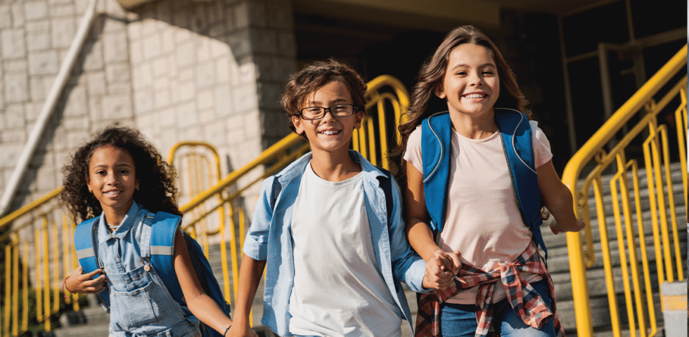 Kids walking together at school.