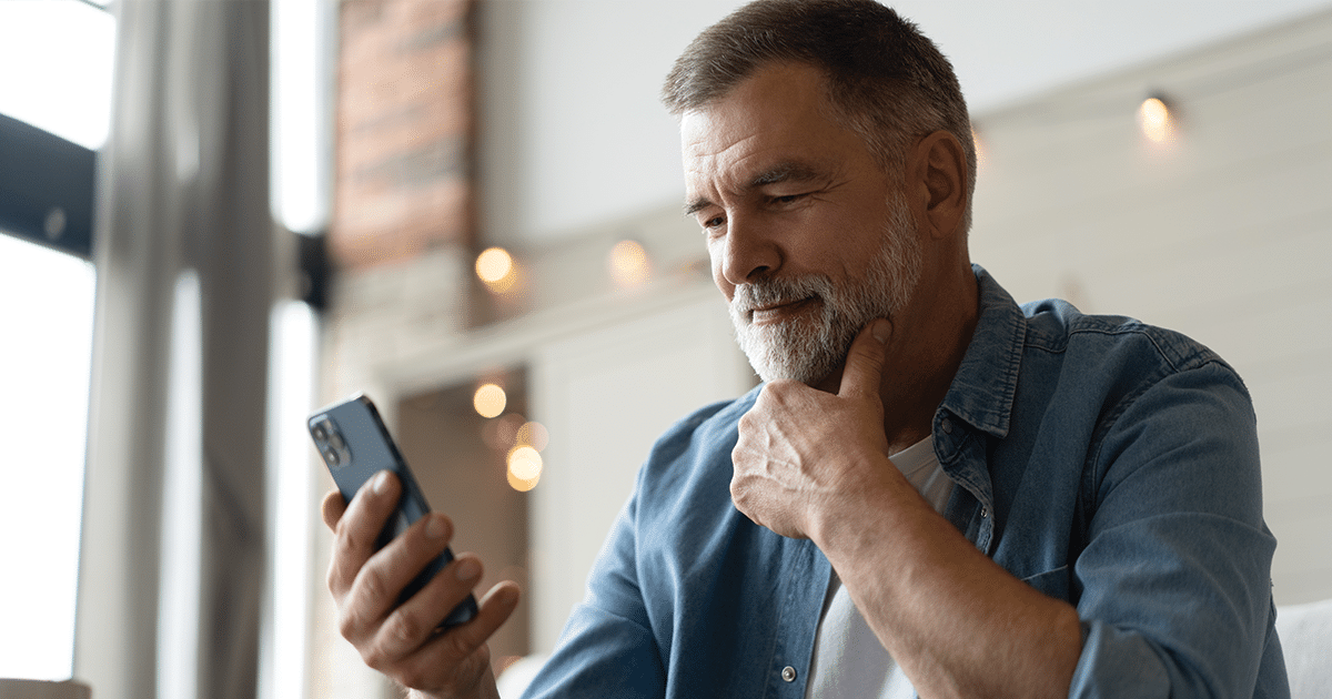man considering receiving heart health care in rural Alaska on phone