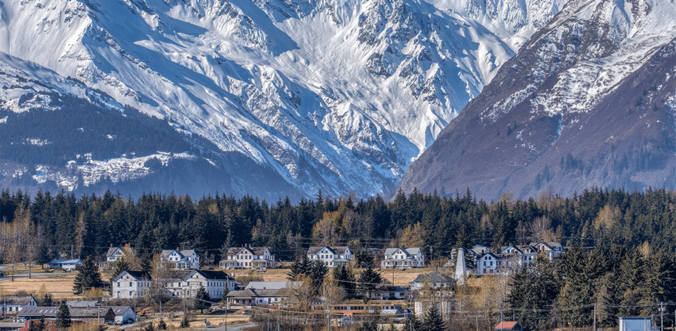 Rural Alaskan village in a mountain valley.