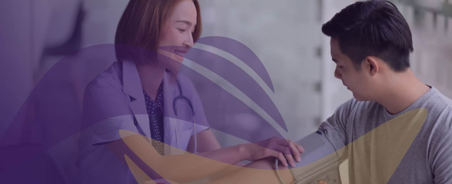 Healthcare provider checks patient's blood pressure